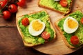 Toasts with avocado, ÃÂherry tomatoes and eggs Royalty Free Stock Photo